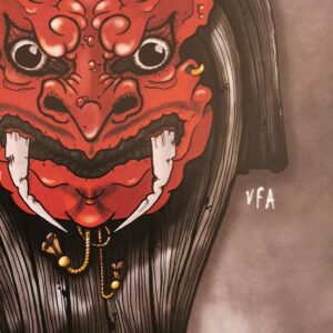 Détail du masque japonais rouge, expression grimaçante, yeux noirs et dents affutés.