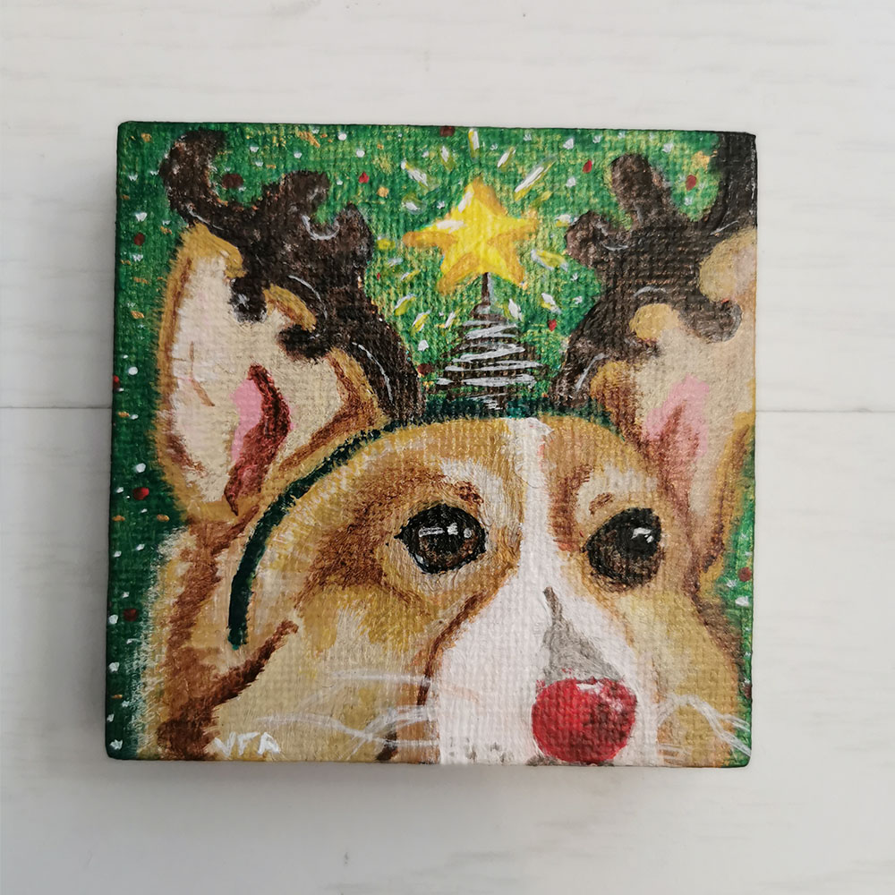 Mini tableau corgi déguisé en rennes de Noël avec une étoile scintillante et un fond coloré vert